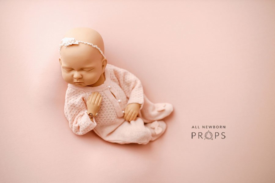 Newborn-photoshoot-outfits-girl-knitted-romper-headband-tieback-posed-bean-bag-all-newborn-props