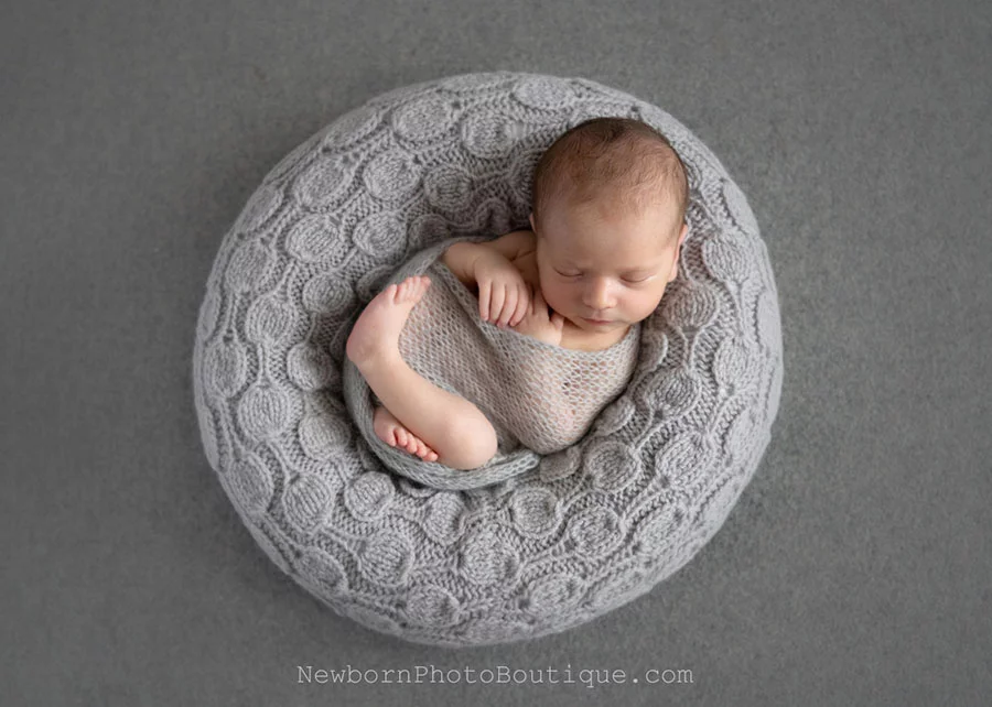 newborn photoshoot ideas baby boy posing ring wrap photography prop