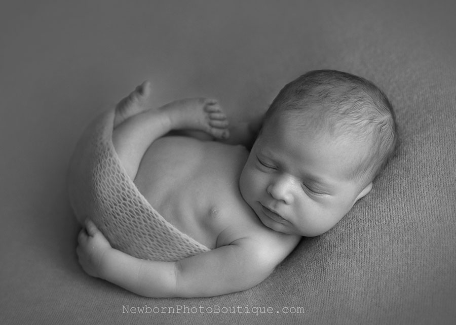 newborn photography ideas boy bean bag wrap