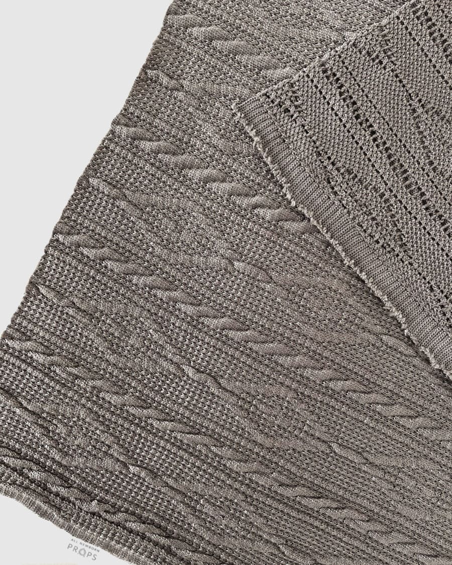 stretch-knit-wrap-for-newborn-photography-boy-dark-grey-neutral-textured-props-europe
