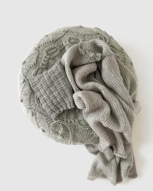newborn-photography-props-matching-bundle-boy-posing-nest-swaddle-hat-tieback-neutral-grey-europe