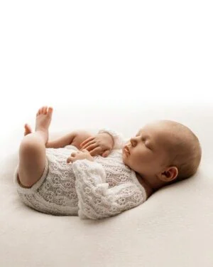 newborn-baby-girl-photo-outfit-romper-neutral-cream-props-europe