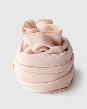 Soft stretchy apricot blush jersey wrap - a prop for a newborn session