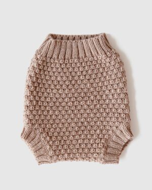 Front view of ochre tan newborn baby bloomers Luther, laid flat to show classic shape and style.