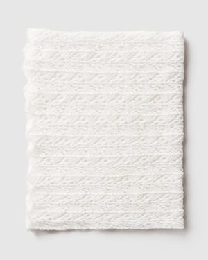 Cream‑coloured stretchy newborn photography wrap Wade folded for flatlay image