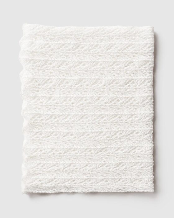 Cream‑coloured stretchy newborn photography wrap Wade folded for flatlay image